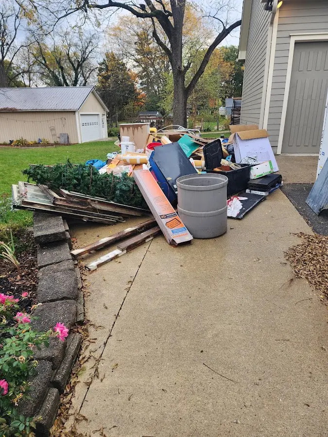 Dumpster being loaded with debris for 10 Yard Dumpster Rental in Moundville